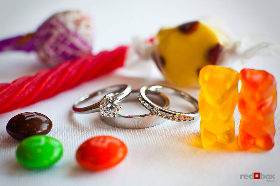 Katherine and Bryan's rings are framed by candy they provided for guests during their wedding at the Women's University Club in Seattle. (Photo by Dan DeLong/Red Box Pictures)