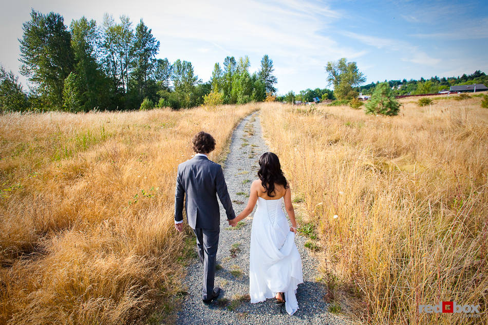 Anghi and Andy walk through the Center for Urban Horticulture in Seattle before their wedding. (Photo by Dan DeLong/Red Box Pictures)