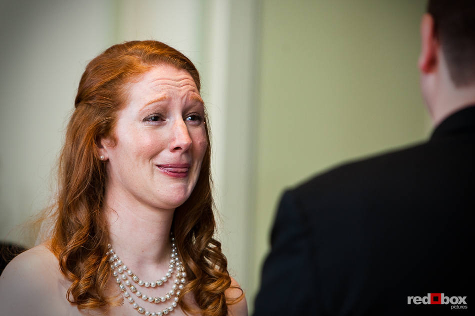 Katherine becomes emotional as she listens to Bryan say his vowe during their wedding in the ballroom of the Women's University Club in Seattle. (Photo by Dan DeLong/Red Box Pictures)