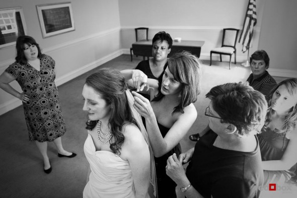 Katherine has help with her veil while getting ready to marry Bryan at the Women's University Club in Seattle. (Photo by Dan DeLong/Red Box Pictures)