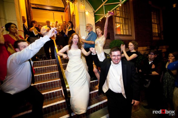 Friends and family give Katherine and Bryan a celebratory sendoff after their wedding at the Women's University Club in Seattle. (Photo by Dan DeLong/Red Box Pictures)