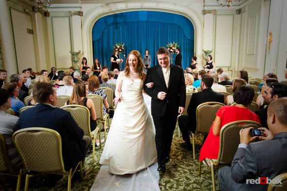 Katherine and Bryan walk down the aisle after being married at the Women's University Club in Seattle. (Photo by Dan DeLong/Red Box Pictures)