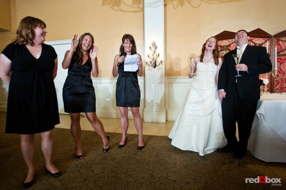 Katherine and Bryan are all smiles while being toasted at their wedding reception at the Women's University Club in downtown Seattle. (Photo by Dan DeLong/Red Box Pictures)