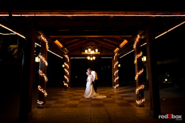 Angi and Mike steal away a moment during their wedding reception at Willows Lodge in Woodinville, WA. (Photo by Dan DeLong/Red Box Pictures)
