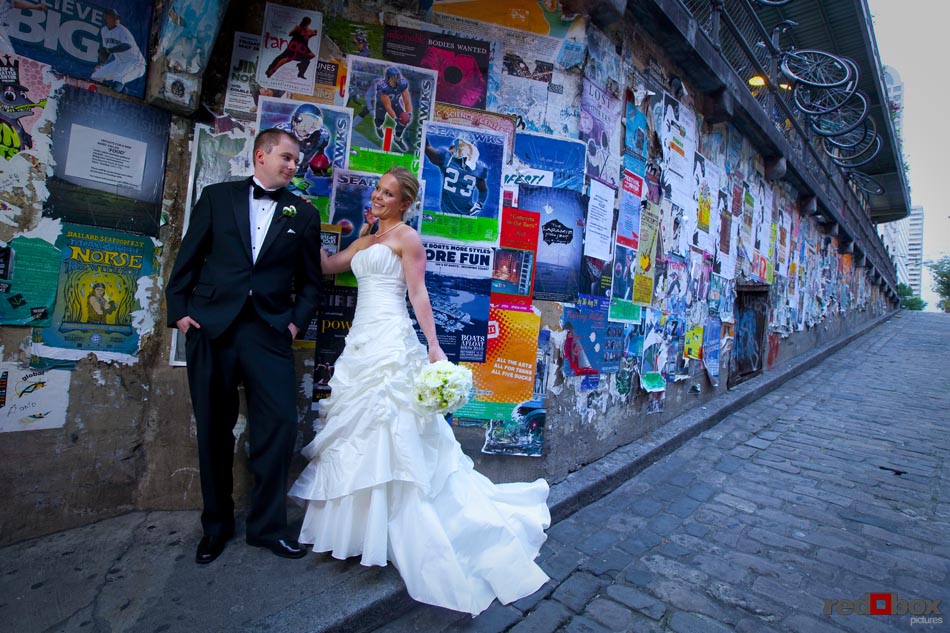 A portrait of the bride and groom at Pike Place Market in Seattle  prior to their wedding at the Top of the Market. Wedding Photographer-Scott Eklund-Red Box Pictures-Seattle