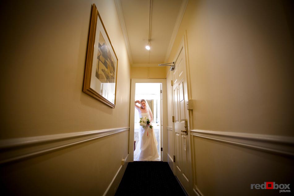 The bride gets ready to leave the Sorrento Hotel before she heads to her wedding at The Hall at Fauntleroy in West Seattle, Washington. (Seattle Wedding Photography Scott Eklund Red Box Pictures)