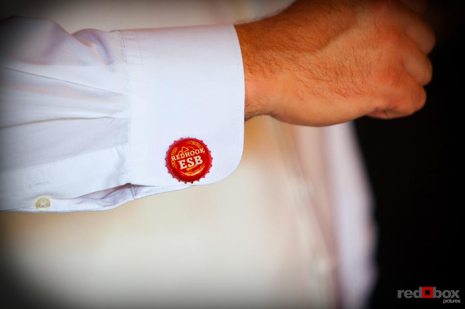 The beer cap cuff links of the groom at his the wedding at The Hall at Fauntleroy in Seattle, Washingon. (Seattle Wedding Photography Rob Sumner Red Box Pictures)