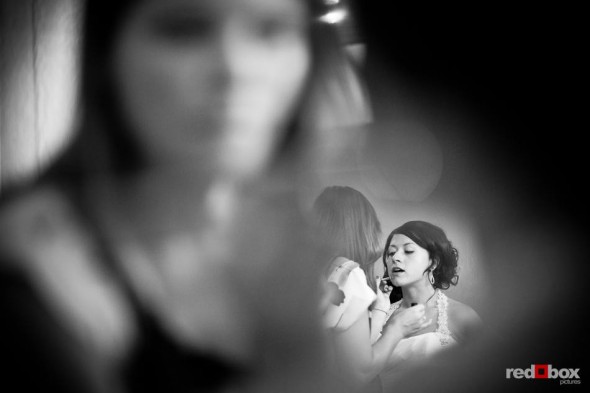 Liz has her makeup touched up before her wedding with Ted at Hidden Meadows in Snohomish, WA. (Photo by Dan DeLong/Red Box Pictures)