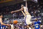 Washington Huskies' Matthew Bryan-Amaning celebrates a dunk, on his way to a career-high 28 points, against the McNeese State Cowboys during thethe men's basketball season opener at UW's Hec Edmundson Pavilion. (Photo by Dan DeLong/Red Box Pictures)