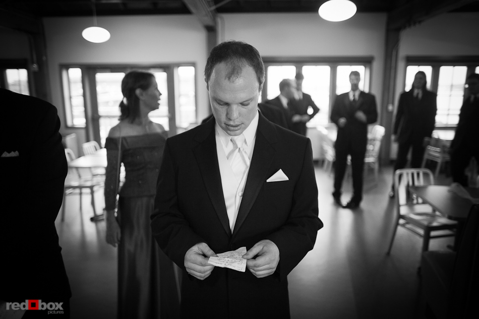 Nick looks over his notes prior to his wedding ceremony at the Seattle Aquarium. (Photography by Andy Rogers/Red Box Pictures)