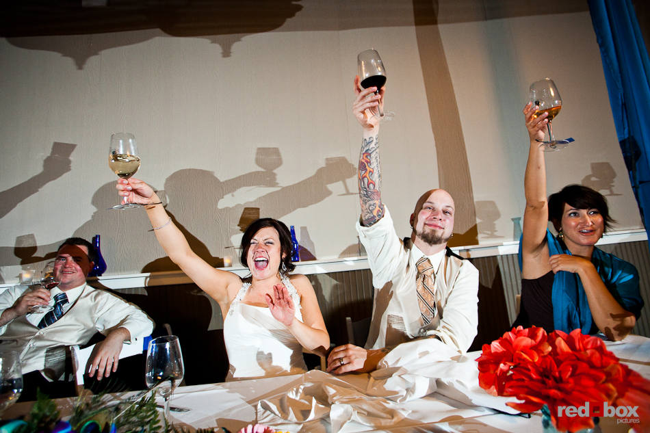 Liz and Ted are toasted during their wedding reception at Hidden Meadows in Snohomish, WA. (Photo by Dan DeLong/Red Box Pictures)