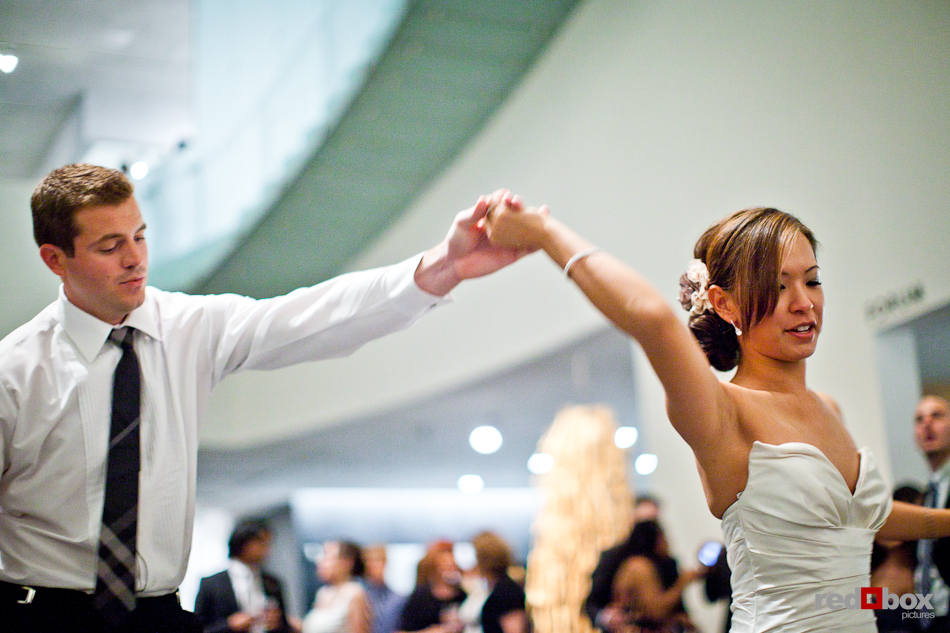 Nora and Neill share their first dance during their wedding reception at the Bellevue Art Museum. (Photo by Dan DeLong/Red Box Pictures)