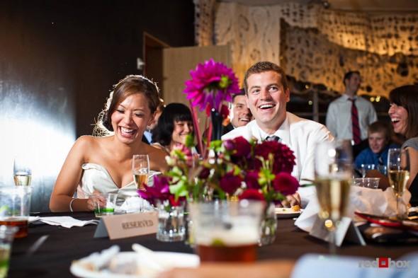 Nora and Neill are toasted a their wedding reception in the Bellevue (WA) Art Museum. (Photo by Dan DeLong/Red Box Pictures)