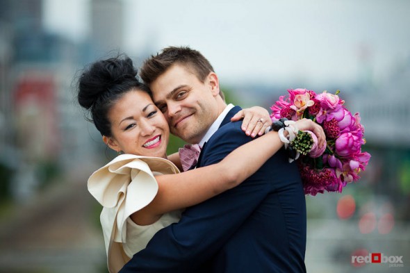 Angie and Jordan pose for a wedding portrait at the SAM Olympic Sculpture Park in Seattle. (Photo by Dan DeLong/Red Box Pictures)