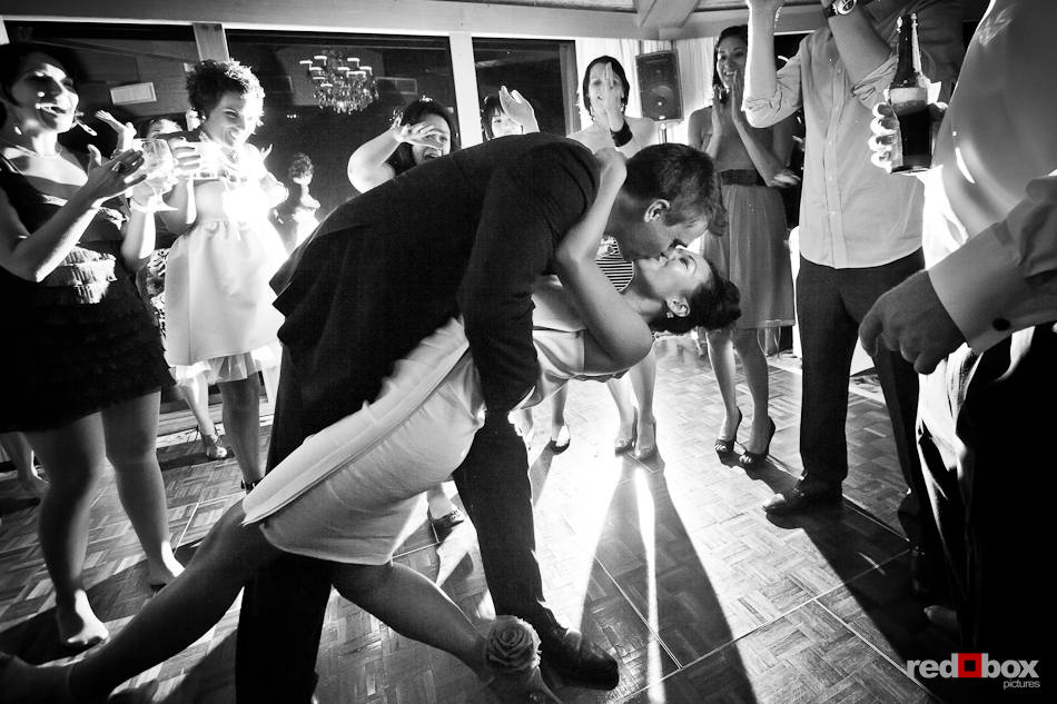 Jordan dips his bride, Angie, while they dance during their wedding reception at the Edgewater Hotel in Seattle. (Photo by Dan DeLong/Red Box Pictures)