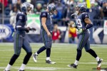 Seattle Seahawk's quarterback Matt Hasselbeck walks of the field, as defenders walk on, following an interception in Carolina territory late in the first half at Qwest Field. (Scott Eklund/Red Box Pictures/Seattle Sports Photography)