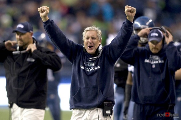 Seattle Seahawk's head coach Pete Carroll celebrates Seattle's final defensive stand at the goal line late in the fourth quarter as the Seattle Seahawks beat the Carolina Panthers. (Seattle Sports Photography By Scott Eklund/Red Box Pictures)