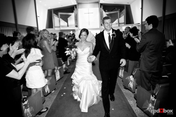 Nora and Neill walk down the aisle after being married at the First United Methodist Church in Bellevue, WA. (Photo by Dan DeLong/Red Box Pictures)