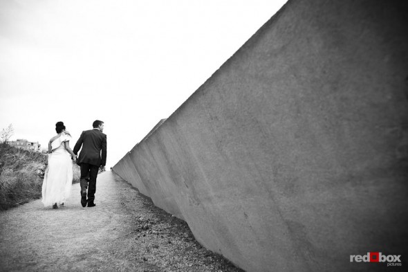 Angie and Jordan stroll through the Seattle Art Museum's Olympic Sculpture Park during a wedding day portrait session in Seattle. (Photo by Dan DeLong/Red Box Pictures)