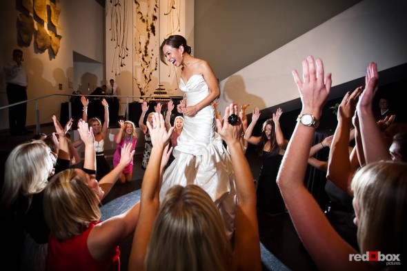 Nora, the bride, is serenaded by her sorority sisters during her wedding reception at the Bellevue Art Museum. (Photo by Dan DeLong/Red Box Pictures)