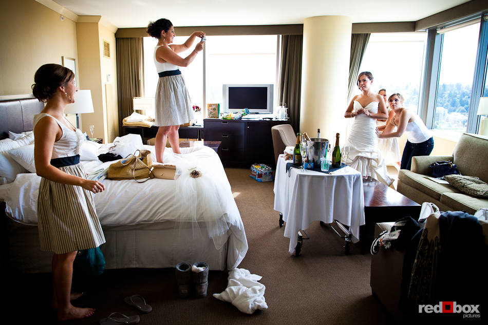 Her bridesmaids help Nora get ready for her wedding in a room at the Westin in Bellevue, WA. (Photo by Dan DeLong/Red Box Pictures)