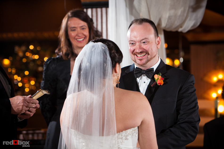 Brian smiles at Tara during their wedding ceremony at the Lake Union Cafe in Seattle. (Photography by Andy Rogers/Red Box Pictures)
