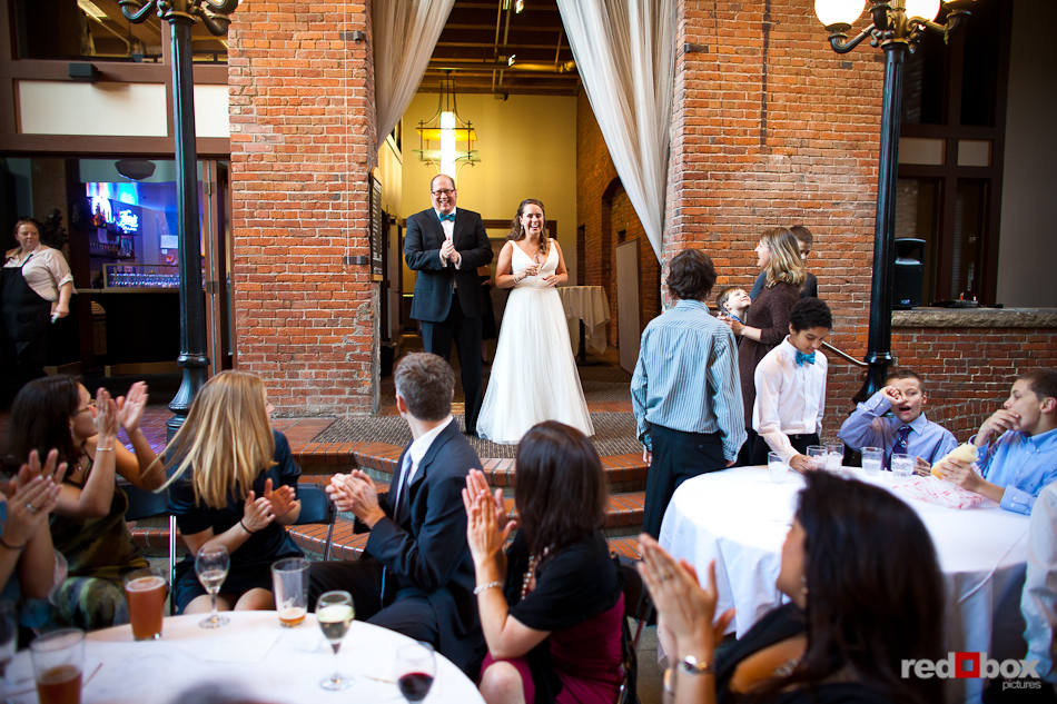 Katie and Bryce greet their guests at their wedding reception at Court in the Square, in Seattle's Pioneer Square neighborhood. (Photo by Dan DeLong/Red Box Pictures)