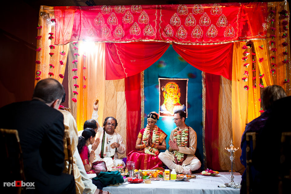 Pundit Mahesh Shastri performs the Indian wedding ceremony at the Uptown Hideaway in Seattle. (Photography by Dan DeLong/Red Box Pictures)