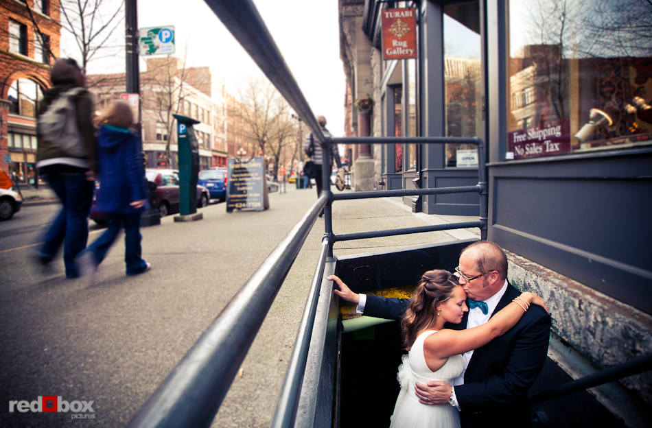 Katie and Bryce share a moment Seattle's Pioneer Square neighborhood on the day of their wedding reception. (Photo by Dan DeLong/Red Box Pictures)