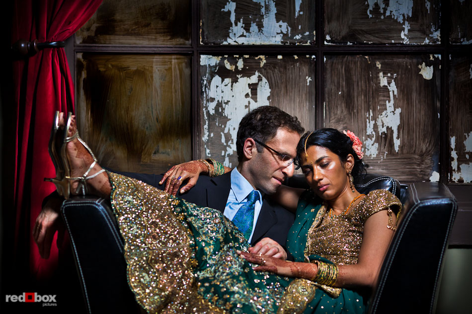 Karthik and Mike relax in a back room at the Uptown Hideaway following their Hindu and Jewish wedding ceremonies in Seattle. (Photo by Andy Rogers/Red Box Pictures)