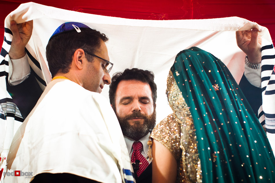 Rabbi Olivier Benhaim performs Karthik and Mike's Jewish wedding ceremony at the Uptown Hideaway in Seattle. (Photo by Dan DeLong/Red Box Pictures)