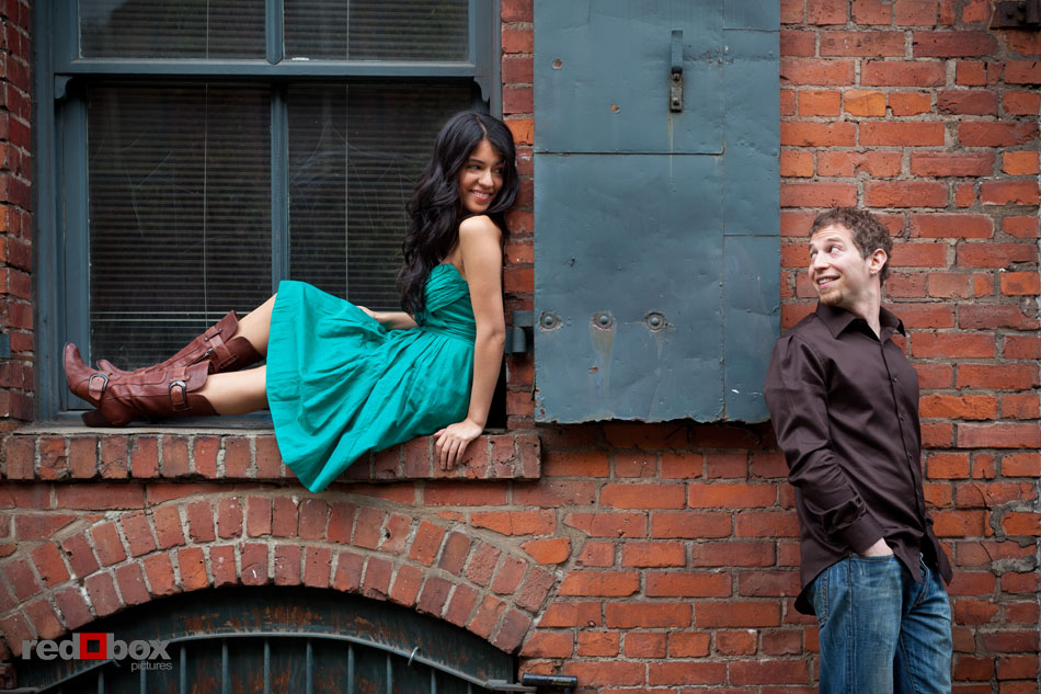 Sharisse and Craig are playful during their engagement photos in Seattle's Pioneer Square. (Photos by Andy Rogers/Red Box Pictures)