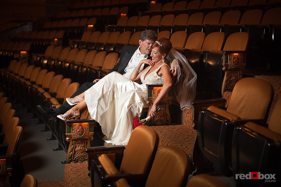Summer and Jeff sit in the seats of The Paramount Theater in Seattle prior to their wedding ceremony. (Photo by Andy Rogers/Red Box Pictures)
