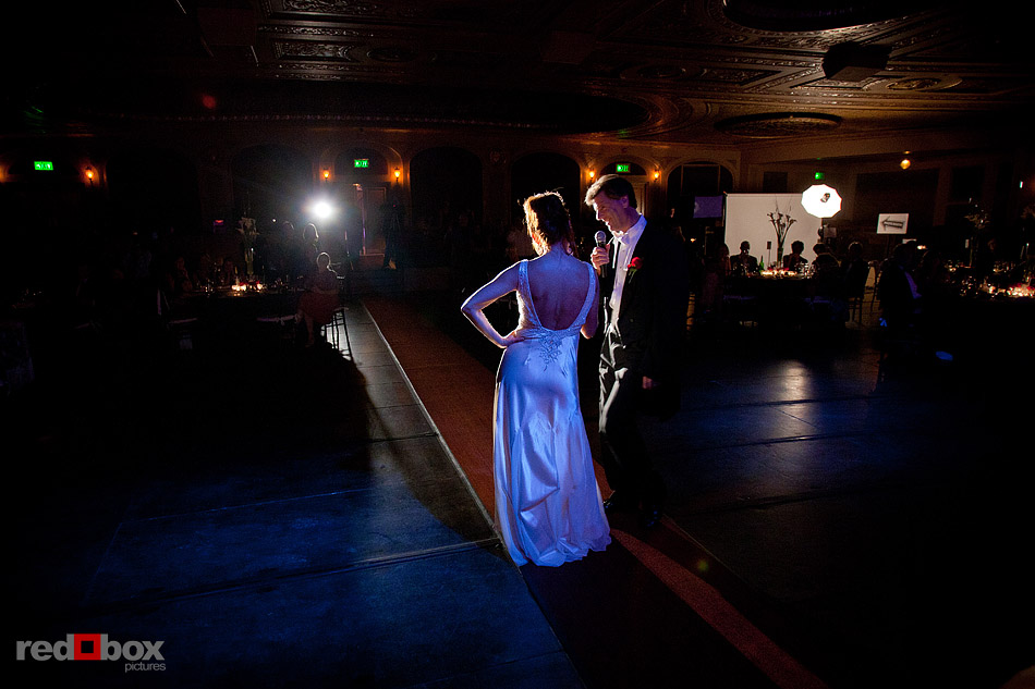 Rather than a first dance, Summer and Jeff perform a song and dance to the delight of their guests during their wedding reception at The Paramount Theater in Seattle. (Photo by Andy Rogers/Red Box Pictures)