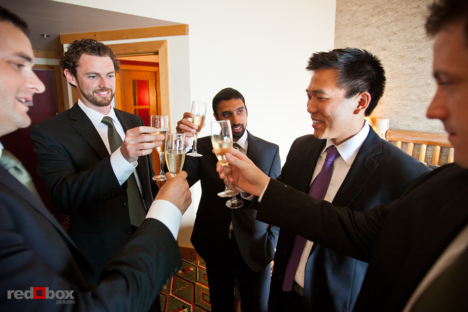 Ted shares a champagne toast with his friends at his room in Edgewater Hotel before his Ray's Boathouse wedding. (Photo by Andy Rogers/Red Box Pictures)