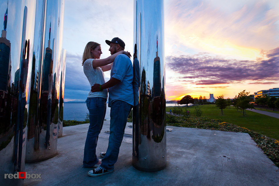 Carlos and Megan enjoy each other and a sunset during their engagement photo session at Myrtle Edwards Park in Seattle. (Photo by Dan DeLong/Red Box Pictures)