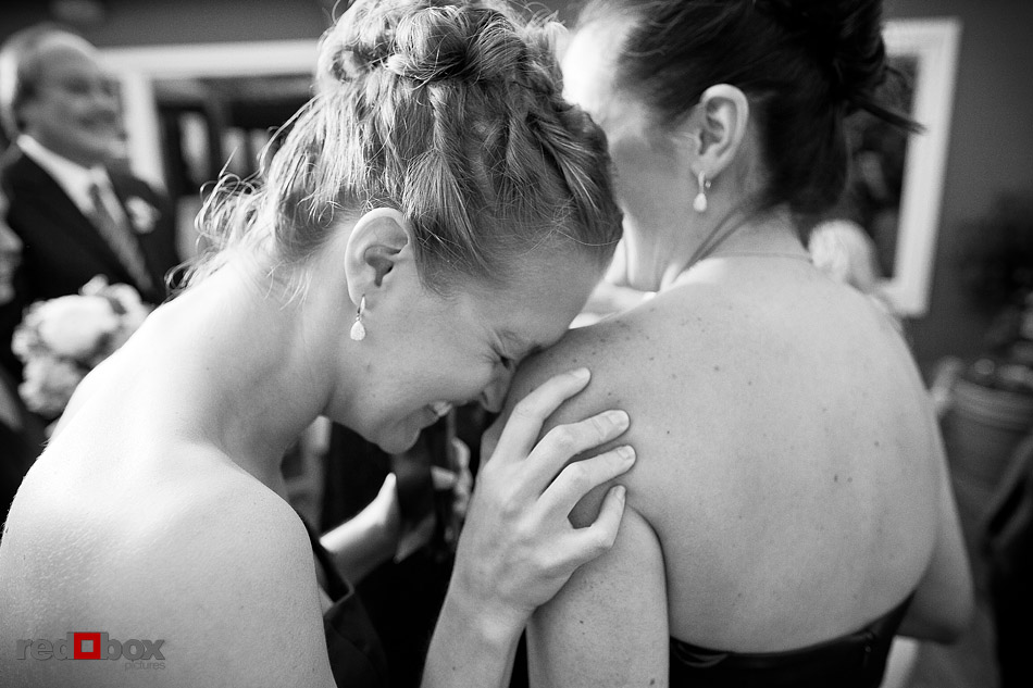 Laura's bridesmaids react after the wedding ceremony at Ray's Boathouse in Seattle. (Photo by Andy Rogers/Red Box Pictures)
