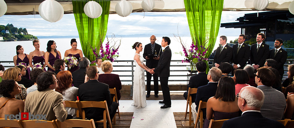Laura and Ted are married on the deck of the Northwest Room at Ray's Boathouse in Seattle. (Photo by Andy Rogers/Red Box Pictures)