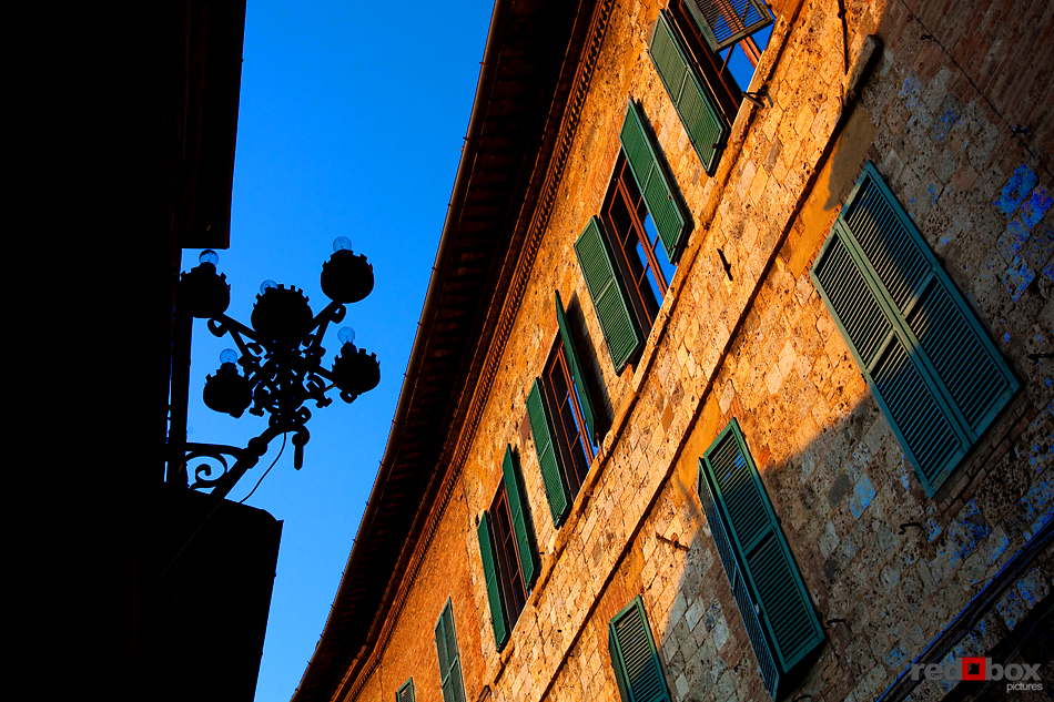 The evening sun reflects off buildings in Siena,Tuscany, Italy. (Italy Photography By Scott Eklund/Red Box Pictures)