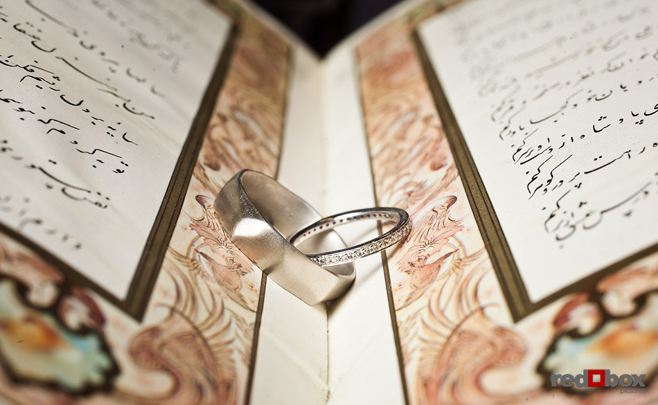 Jane and Kia's wedding rings sit on The Koran. Velocity Dance Center in Seattle.. (Photo by Andy Rogers/Red Box Pictures)