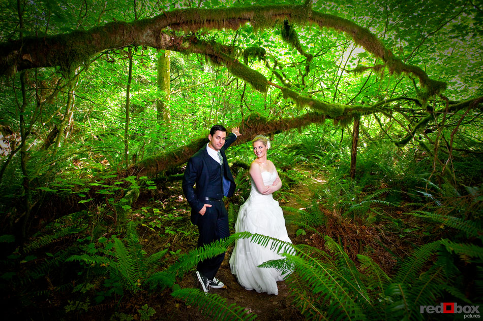 The bride and groom stand for a portrait in the woods at Treehouse Point in Issaquah, Wash. (Seattle Wedding Photographer Scott Eklund/Red Box Pictures)