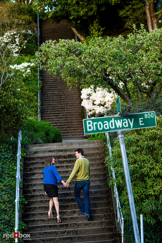 Christine and Dan climb the Blaine Stairs toward Capital Hill during their engagement photo session in Seattle. (Photos by Andy Rogers/Red Box Pictures)