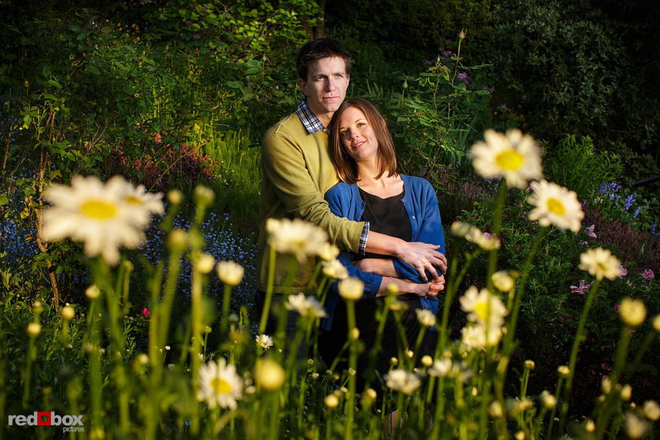 Christine and Dan with daisies at Streissguth Gardens along the Blaine Stairs during their Seattle engagement photos. (Photos by Andy Rogers/Red Box Pictures)