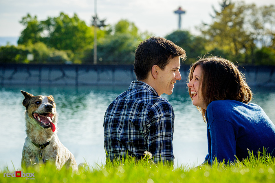 Christine and Dan are show with the Space Needle in their Seattle engagement photos at Volunteer Park in Seattle. (Photos by Andy Rogers/Red Box Pictures)