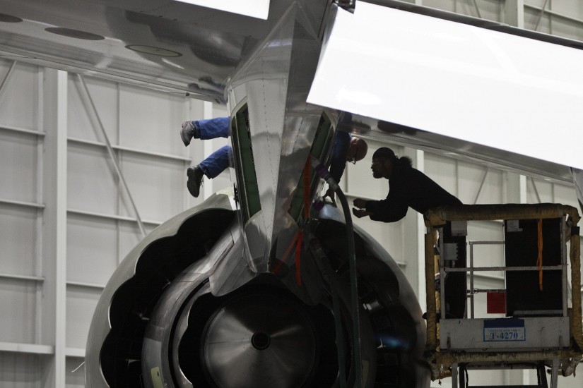 Boeing workers perform functional testing on engine during production of 747-8. (Photography by Rob Sumner / Red Box Pictures)