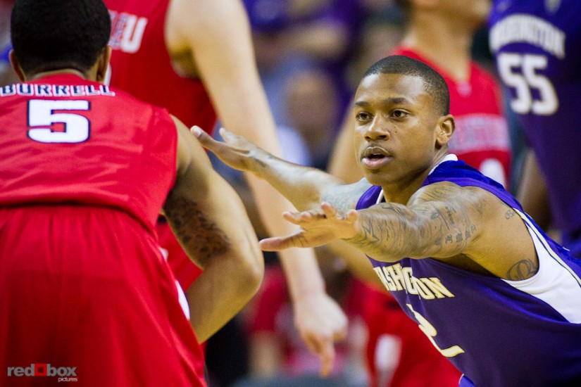 The University of Washington Huskies' guard Isaiah Thomas defends against the Seattle University Redhawks at Key Arena in Seattle Tuesday, Feb. 22, 2011. (Photo by Andy Rogers/Red Box Pictures)