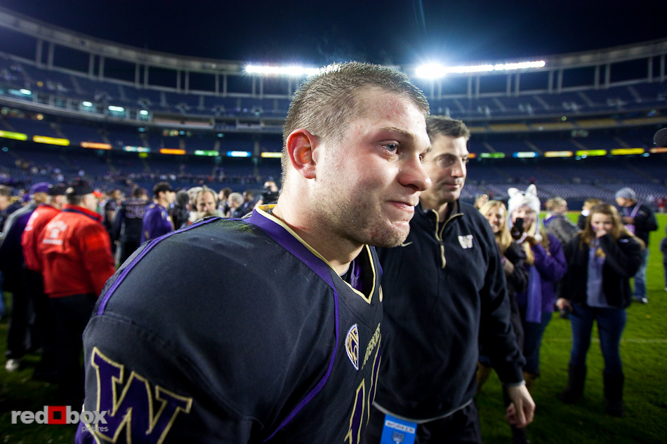jake-locker-holiday-bowl-tear Jake Locker has a tear in his eye after being congratulated by Doug Nussmeier following the University of Washington's defeat of Nebraska in the 2010 Bridgepoint Education Holiday Bowl 19-7 at Qualcomm Stadium in San Diego. (Photography By Scott Eklund/Red Box Pictures)