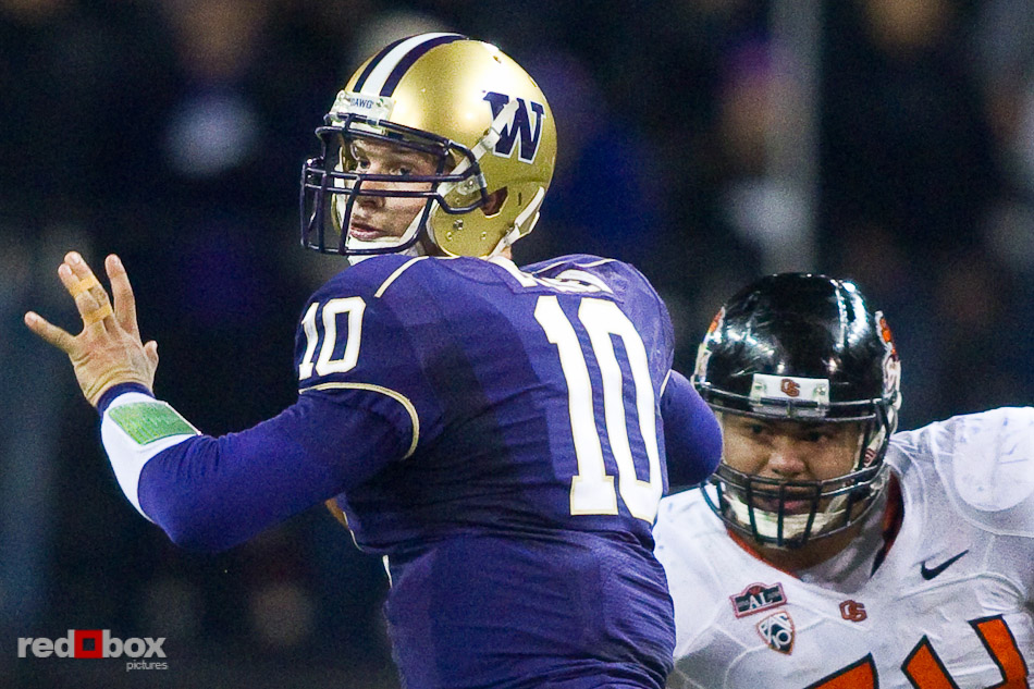 jake-locker-passing-photo-osu University of Washington quarterback Jake Locker prepares to pass against Oregon State University. UW defeated OSU 35-34 in double overtime at Husky Stadium in Seattle on Saturday October 16, 2010. (Photography By Scott Eklund/Red Box Pictures)