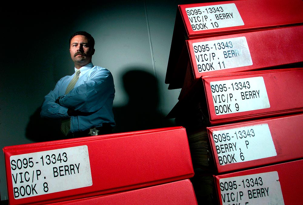 Detective John Padilla, of the Snohomish County Sheriff's Office, had accumulated a huge file on the Patricia Berry murder case, but had been unable to discover her killer after four years of investigation. (Photorapher: Andy Rogers)