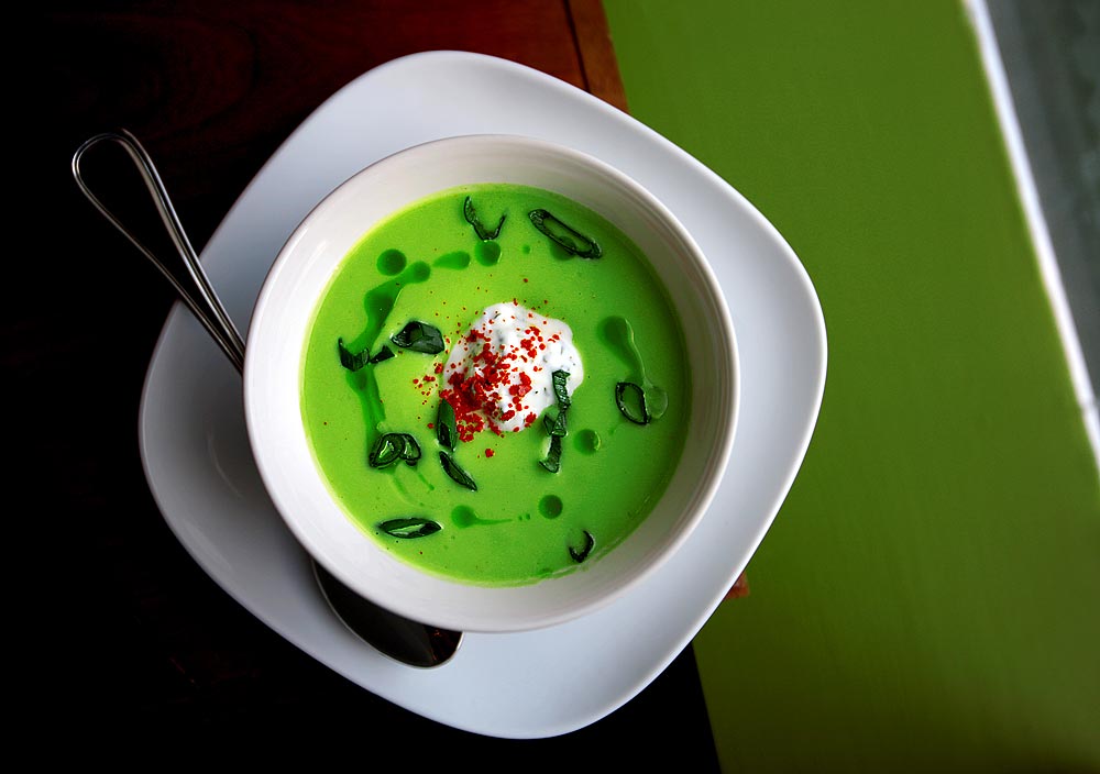 Chilled avocado soup with basil-lemon yogurt at Art of the Table restaurant in Seattle. (Photographer: Scott Eklund)